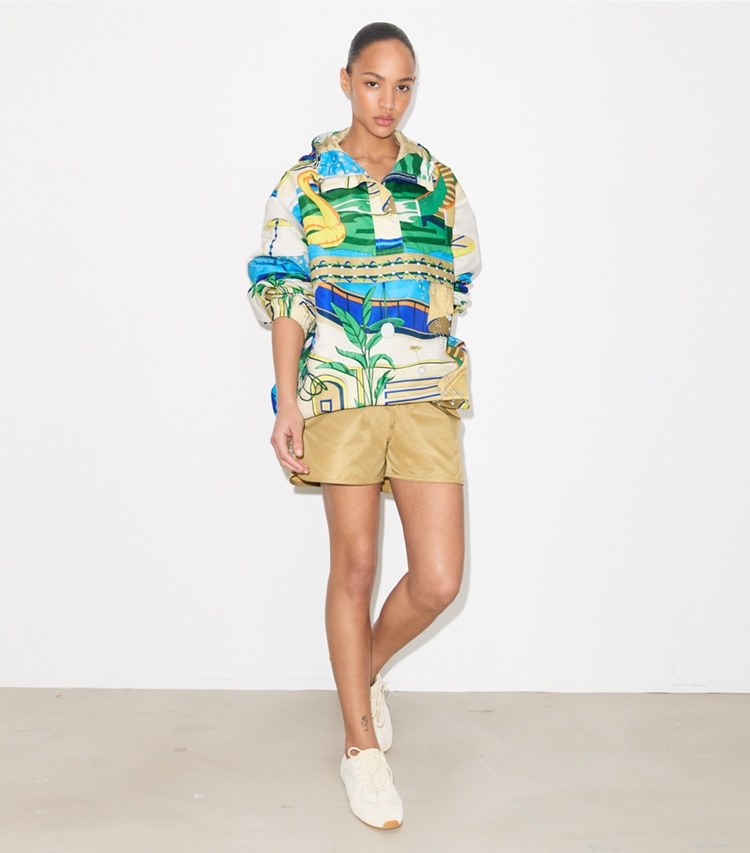 Tory Burch designer jackets Nylon Half-Zip Anorak in Green Pool on model front