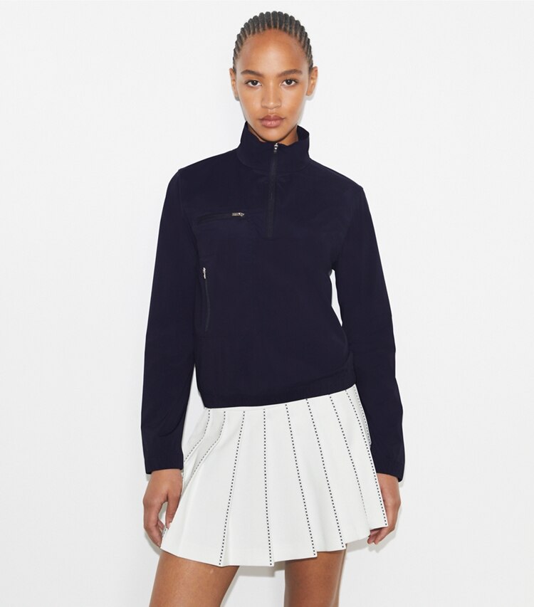 Tory Burch designer jackets Nylon Half-Zip Golf Jacket in Deep Navy on model detail