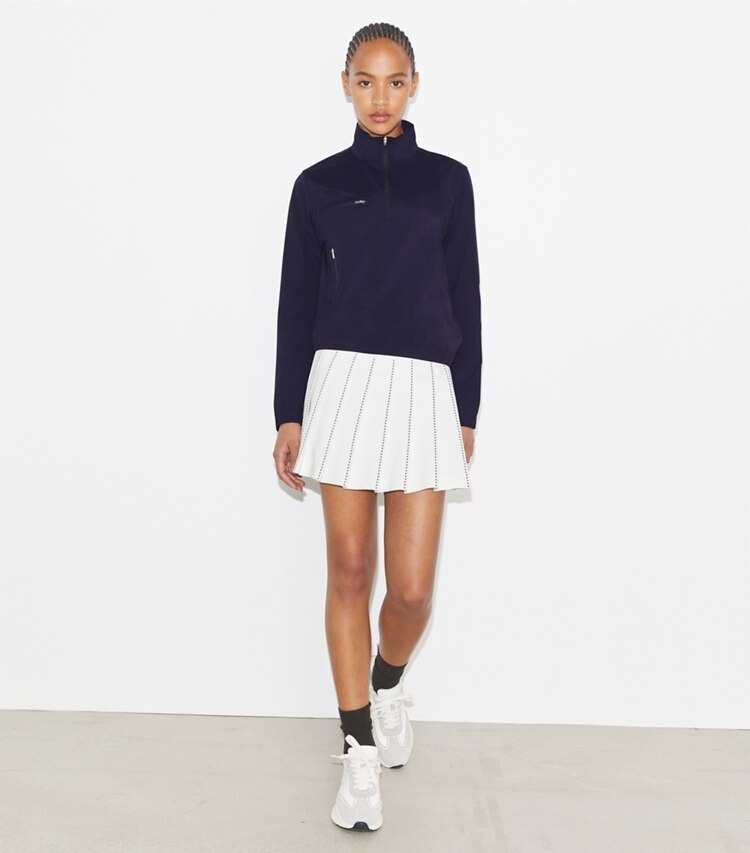 Tory Burch designer jackets Nylon Half-Zip Golf Jacket in Deep Navy on model front
