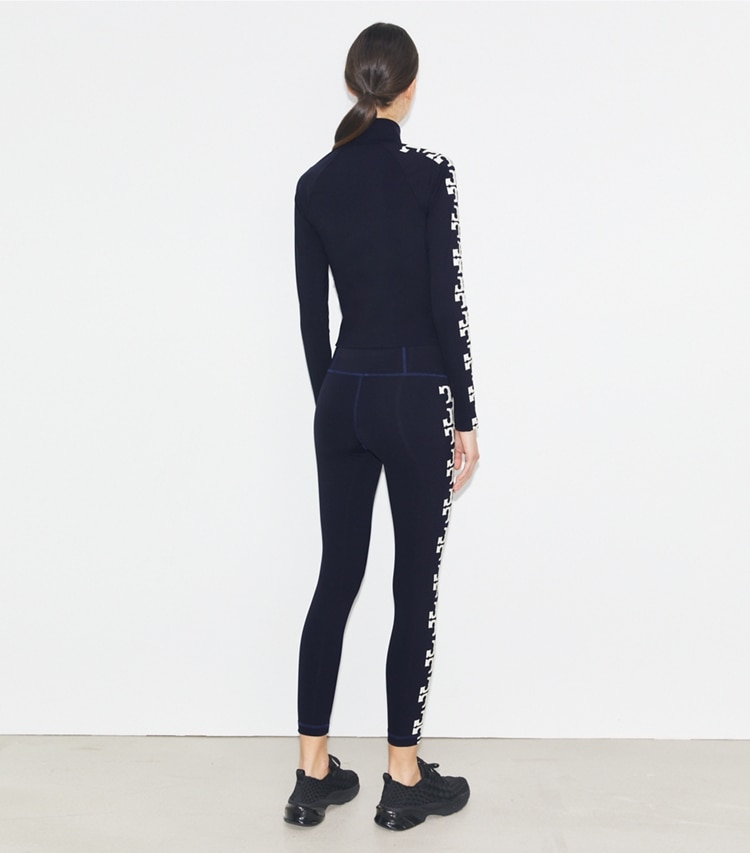 Tory Burch designer tops Nylon Logo Zip Top in Deep Navy on model back