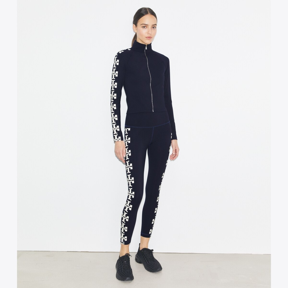 nylon-logo-zip-top-on-model-