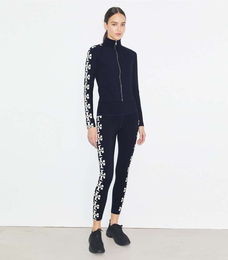 Tory Burch designer tops Nylon Logo Zip Top in Deep Navy on model front