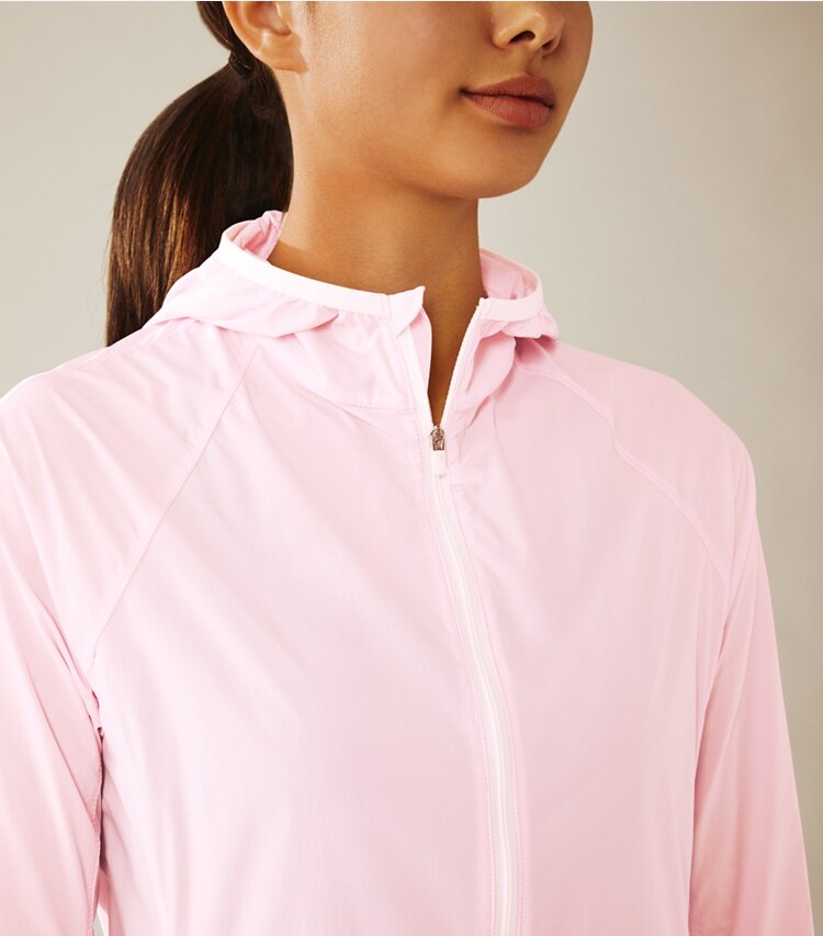 Tory Sport designer jackets Nylon Packable Jacket in Cotton Pink on model detail