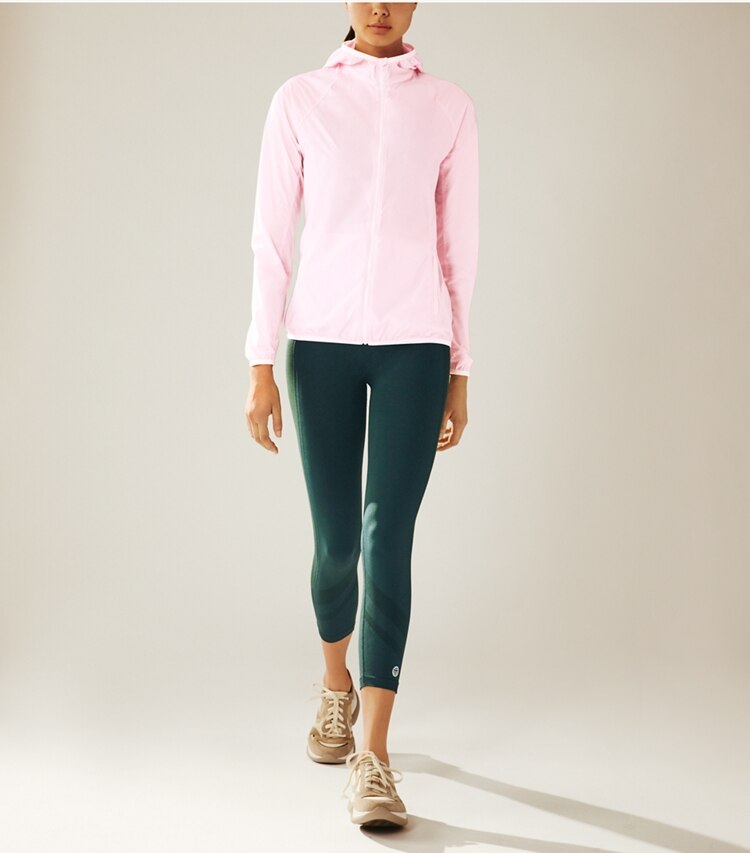Tory Sport designer jackets Nylon Packable Jacket in Cotton Pink on model front