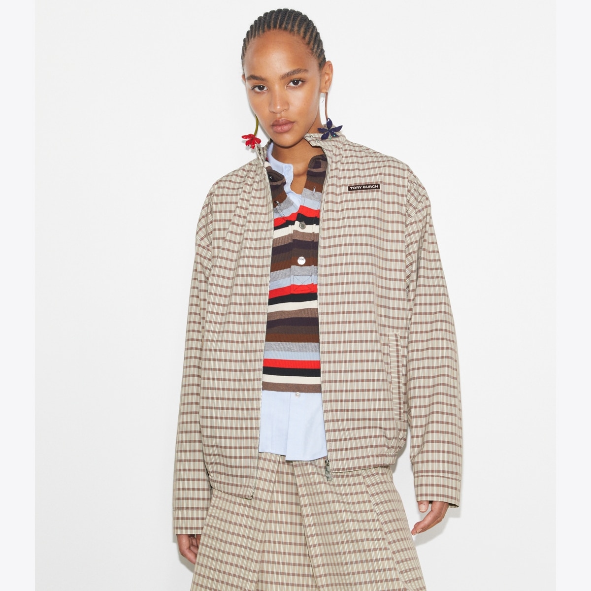 nylon-plaid-golf-jacket-on-