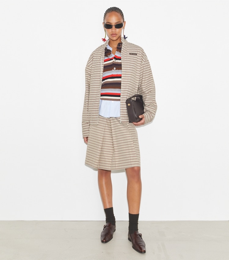 Tory Burch designer jackets Nylon Plaid Golf Jacket in Crimson Rust Dense Plaid Sport on model front