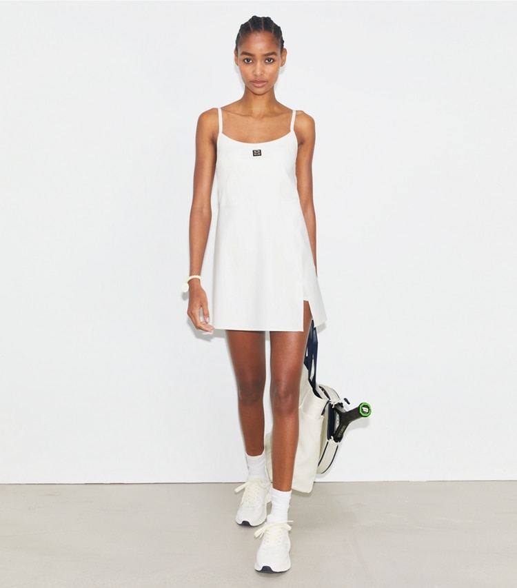 Tory Sport designer dresses Nylon Tennis Dress in Snow White on model front