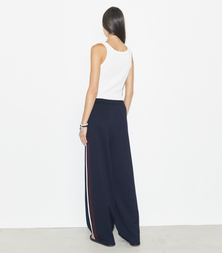 Tory Burch designer bottoms Oversized Jersey Track Pant in Medium Navy on model back