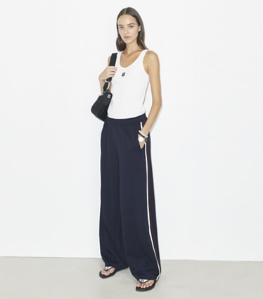 Tory Burch designer bottoms Oversized Jersey Track Pant in Medium Navy on model front