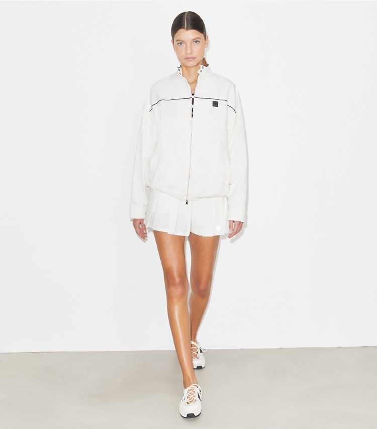 Tory Burch designer jackets Oversized Nylon Tennis Jacket in Snow White on model front