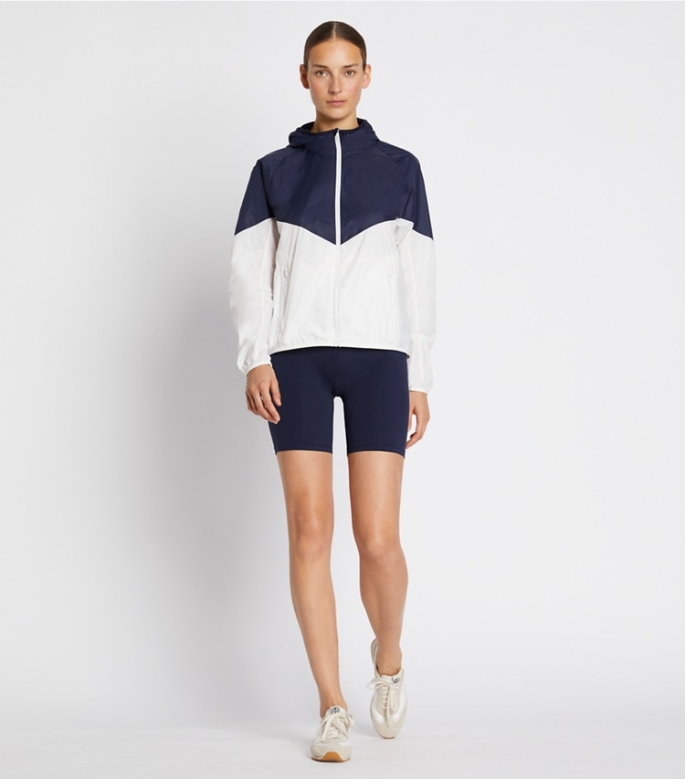 Tory Sport designer jackets Packable Nylon Chevron Anorak in Tory Navy/Snow White on model front