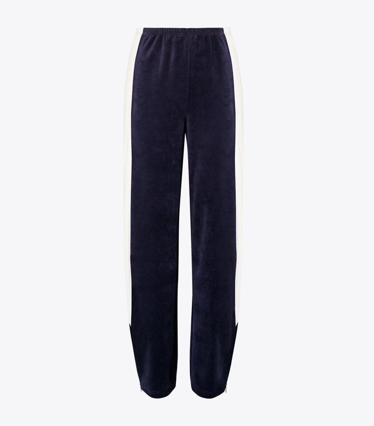 Tory Burch diseñador prendas de abajo Pantalón de chándal de terciopelo con bloques de color en Medium Navy / New Ivory frente