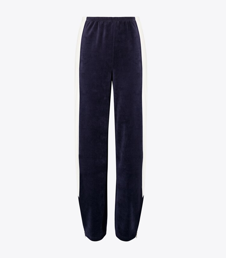 Tory Burch designer bas Pantalon d’entraînement en velours à blocs de couleurs dans Medium Navy / New Ivory de face