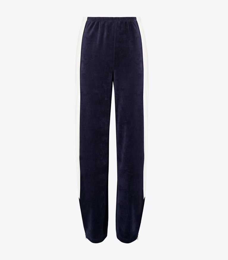 Tory Burch designer bas Pantalon d’entraînement en velours à blocs de couleurs dans Medium Navy / New Ivory de face