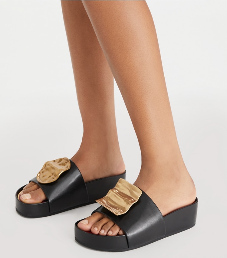 Tory Burch designer sandals Patos Mismatched Platform Slide in PERFECT BLACK / TORY RED / ANCIENT GOLD accessory on model