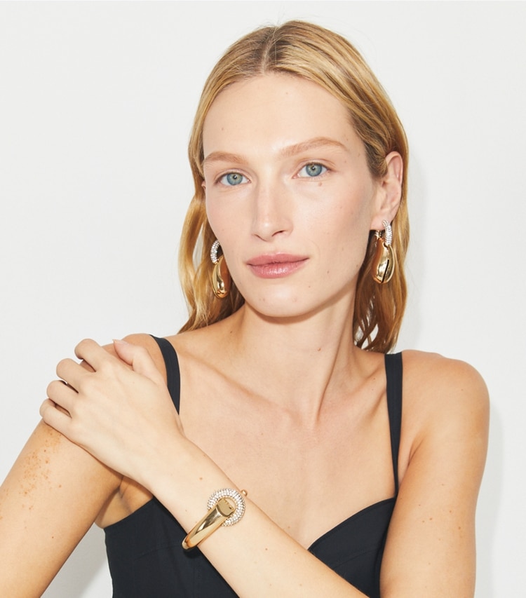 Tory Burch designer bracelets Pavé Pierced Cuff in Light Brass / Crystal accessory on model