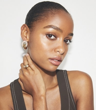 Tory Burch designer earrings Pavé Pierced Hoop Earrings in Light Brass / Crystal accessory on model