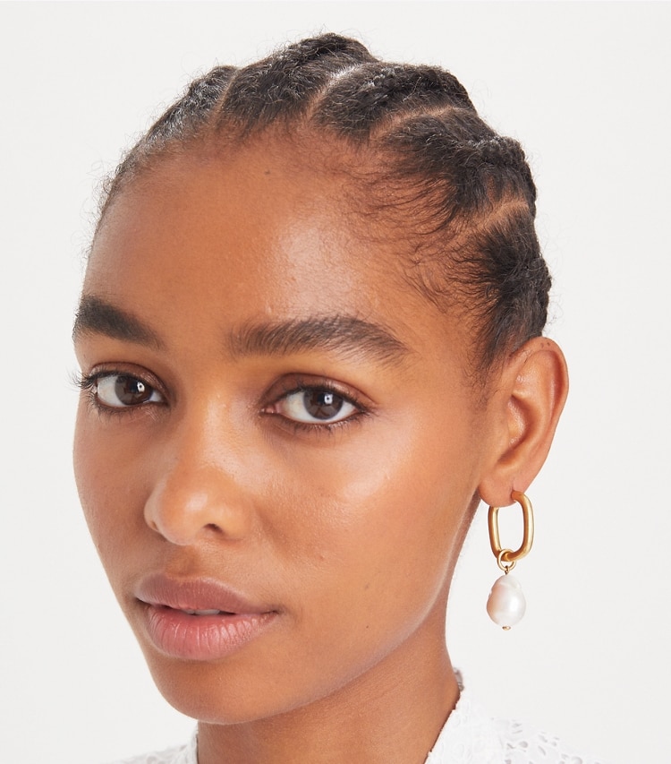 Tory Burch designer earrings Pearl Drop Earring in Antique Light Brass / Pearl accessory on model