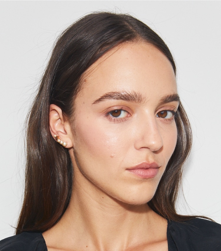 Tory Burch designer earrings Pearl Ear Crawler in Tory Gold / Pearl accessory on model