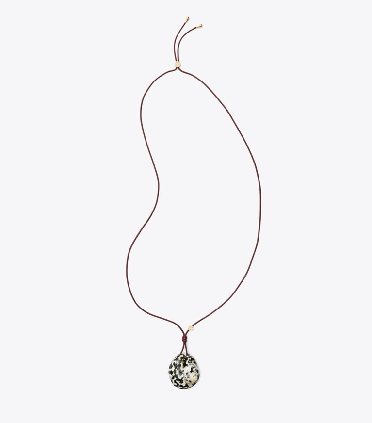 Tory Burch designer colliers Pendentif coquillage dans Black / White de face