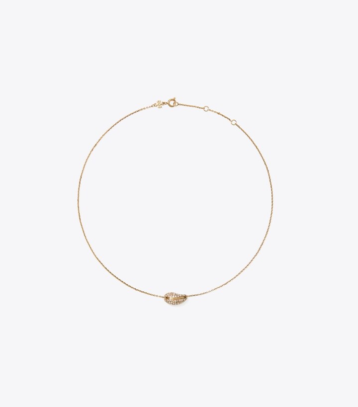 Tory Burch designer colliers Pendentif pavé Pierced in Light Brass / Crystal front