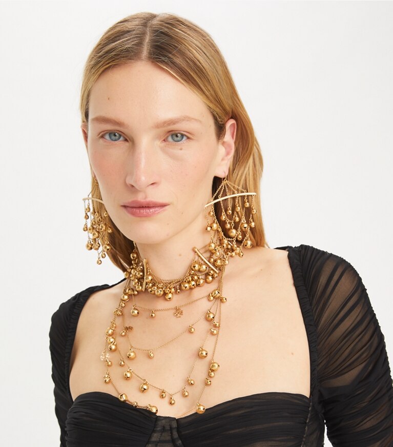 Tory Burch diseñador aretes Pendientes de campana Curiosity en Antique Light Brass accesorio en modelo