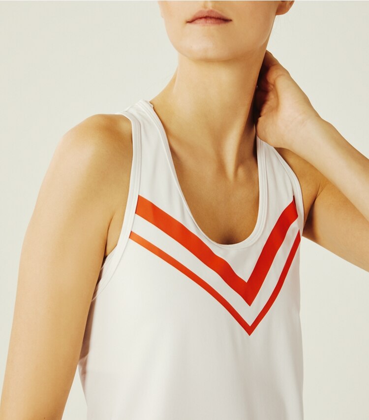 Tory Sport designer tops Performance Chevron Tank in Snow White/Varsity Orange on model detail
