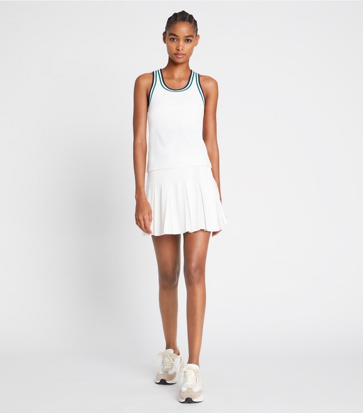 Tory Sport designer tops Performance Jersey Racerback Tennis Tank in Snow White / Evergreen on model front