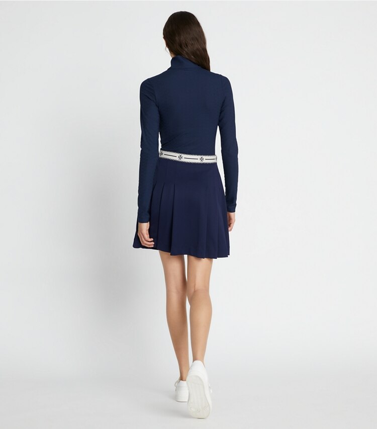 Tory Sport designer ボトムス ロゴテープ ナイロン ゴルフスカート in Tory Navy on model back