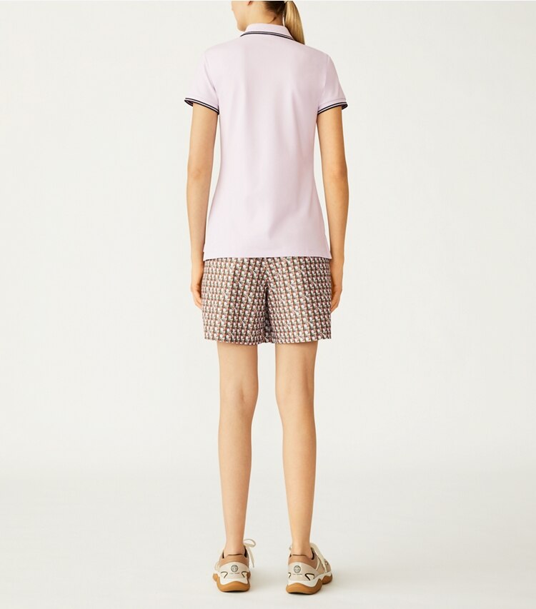 Tory Sport designer tops Performance Piqué Heart Polo in Cool Lavender on model back
