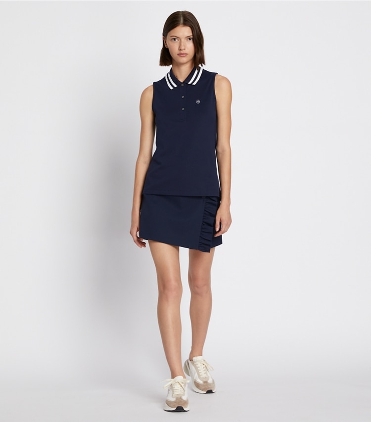 Tory Sport designer tops Performance Piqué Pleated Collar Sleeveless Polo in Tory Navy/Snow White on model front