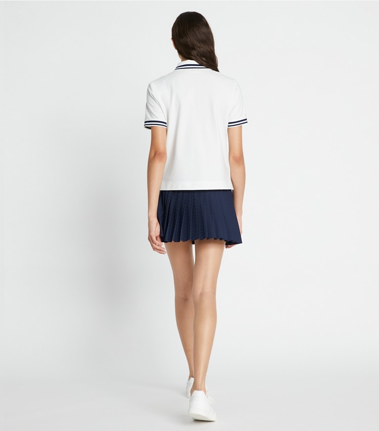 Tory Sport designer tops Performance Piqué Polo in Snow White / Tory Navy front