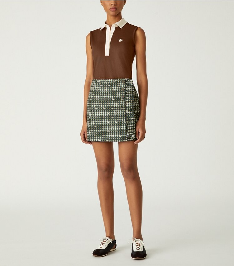 Tory Sport designer tops Performance Piqué Sleeveless Color-Block Polo in Dark Roast / NEW IVORY on model front