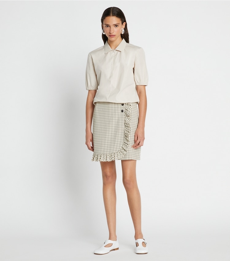 Tory Sport designer bottoms Performance Twill Golf Skirt in Sesame Petite Plaid on model front