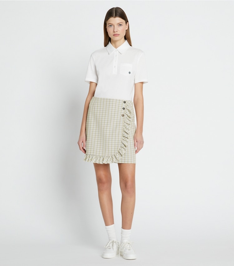 Tory Sport designer bottoms Performance Twill Golf Skirt in New Ivory Pin Stripe Plaid on model front