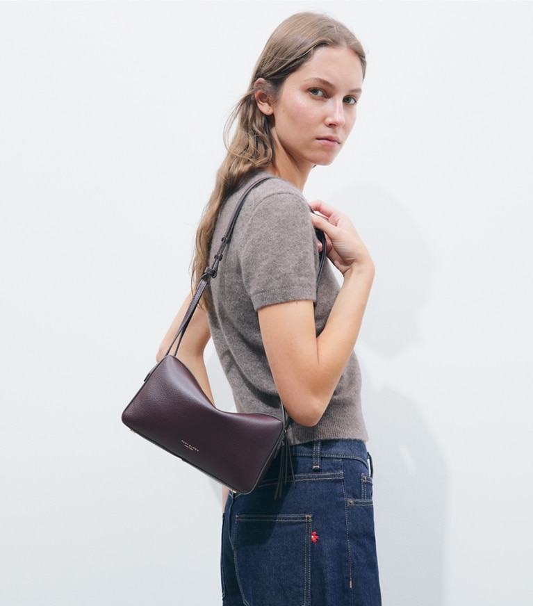 Tory Burch designer crossbody bags Perry Crossbody in Dark Carmine accessory on model
