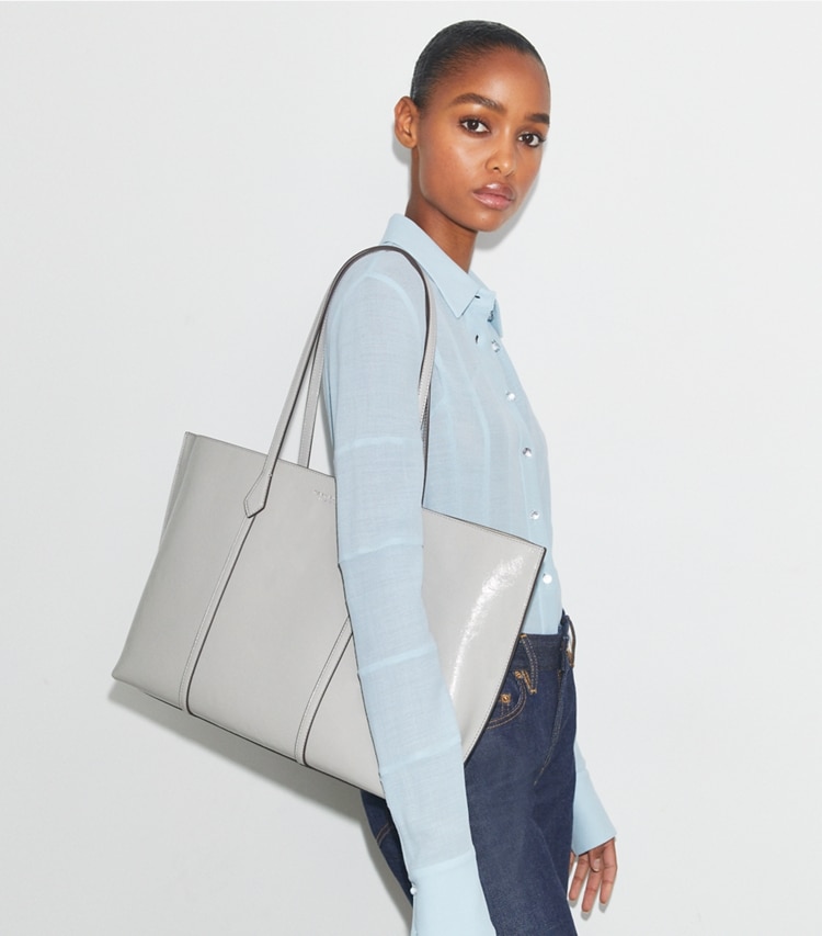 Tory Burch designer tote bags Perry Distressed Tote in Light Granite accessory on model