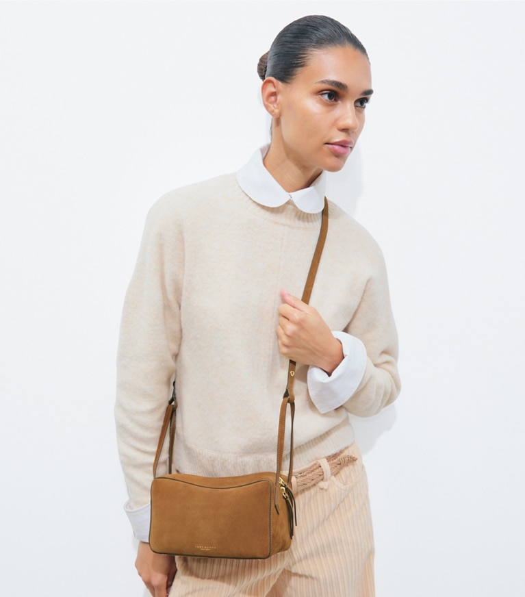 Tory Burch designer crossbody bags Perry Suede Crossbody in Umber accessory on model