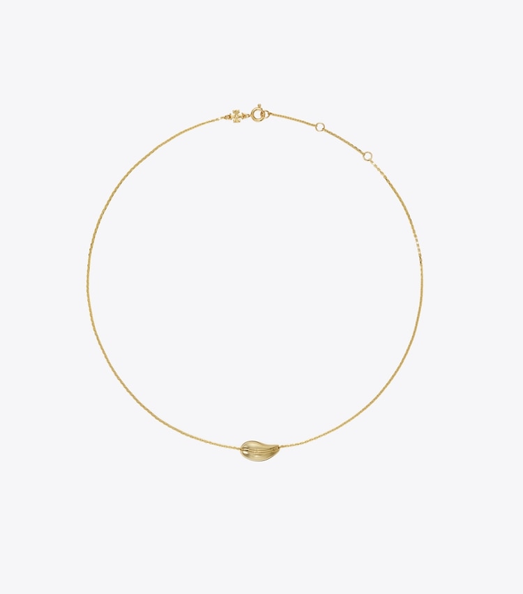 Tory Burch designer colliers Petit pendentif ajouré dans Light Brass de face