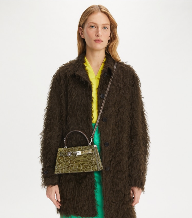 Tory Burch designer mini bags Petite Lee Radziwill Croc-Embossed Bag in Soft Ivy accessory on model