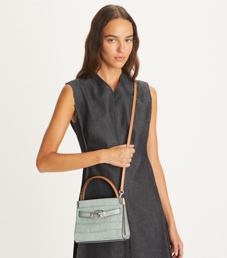 Tory Burch designer crossbody bags Petite Lee Radziwill Croc-Embossed Double Bag in Blue Celadon accessory on model