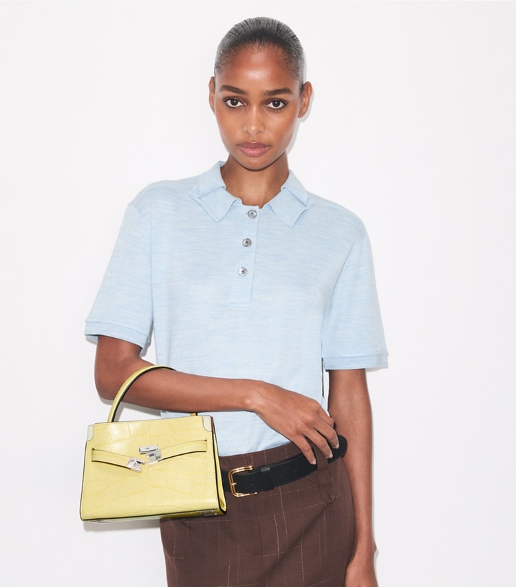 Tory Burch designer crossbody bags Petite Lee Radziwill Croc-Embossed Double Bag in Yellow Sky accessory on model