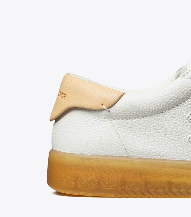 Tory Burch designer sneakers Phoenix Sneaker in WHITE / WHITE / BRUSHED ALMOND angle