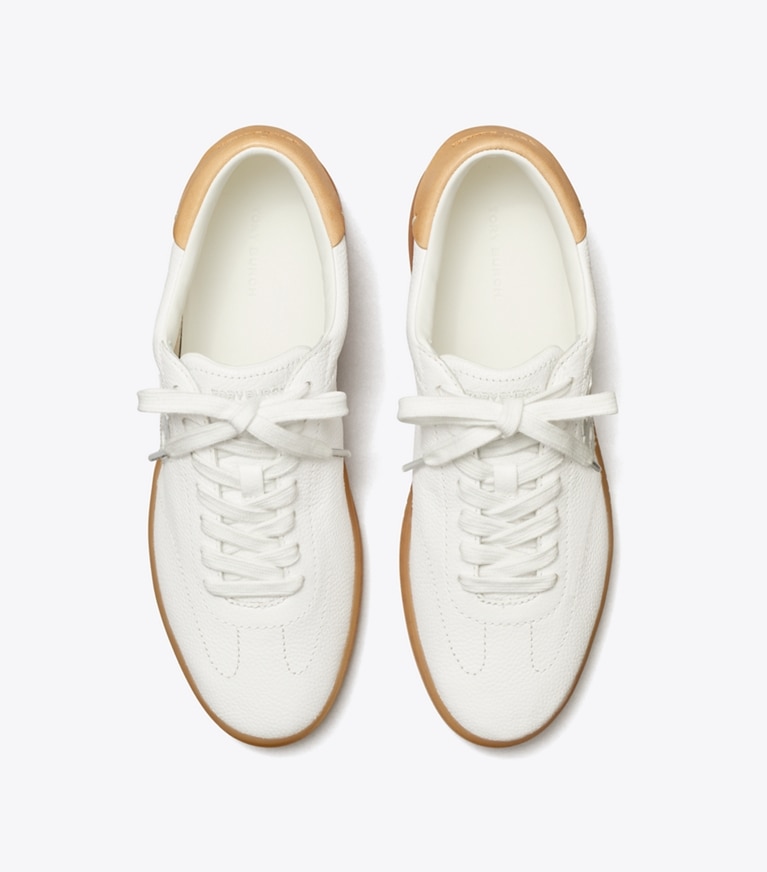 Tory Burch designer sneakers Phoenix Sneaker in WHITE / WHITE / BRUSHED ALMOND angle