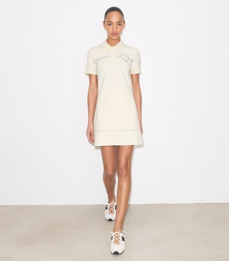 Tory Burch designer dresses Pick Stitch Stretch Polo Dress in New Ivory on model front