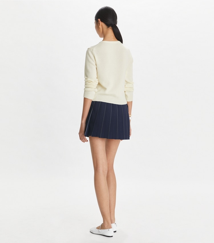 Tory Sport designer bottoms Pickstitch Pleated Skirt in Tory Navy on model back