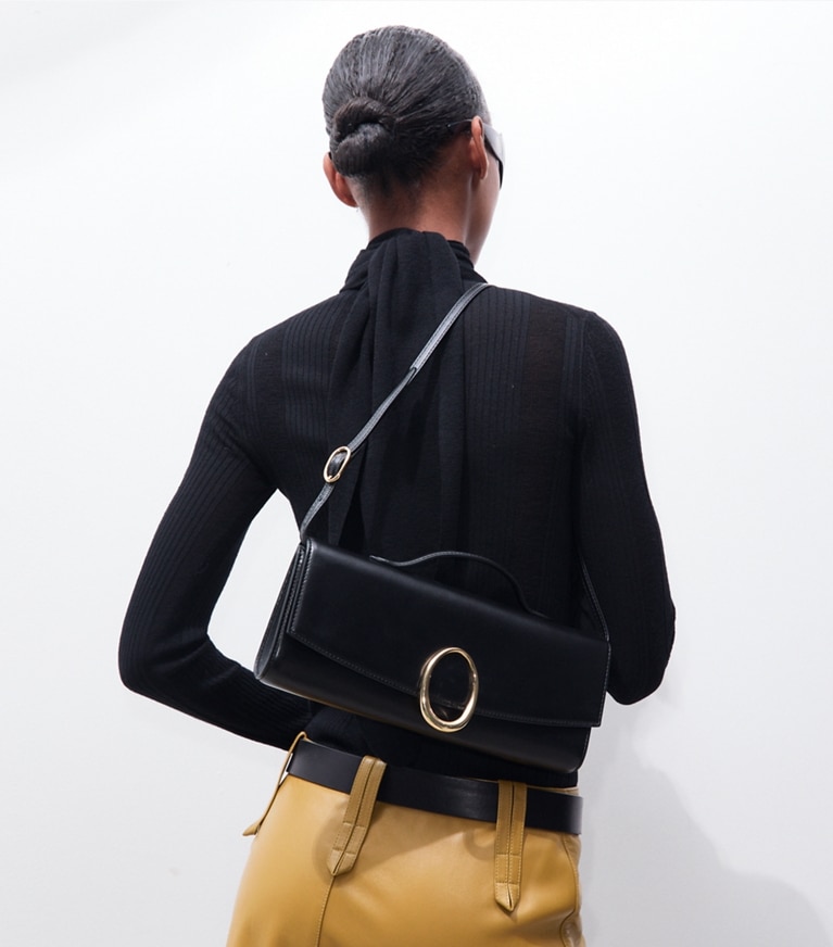 Tory Burch designer clutches Pierced Clutch in BLACK additional on model