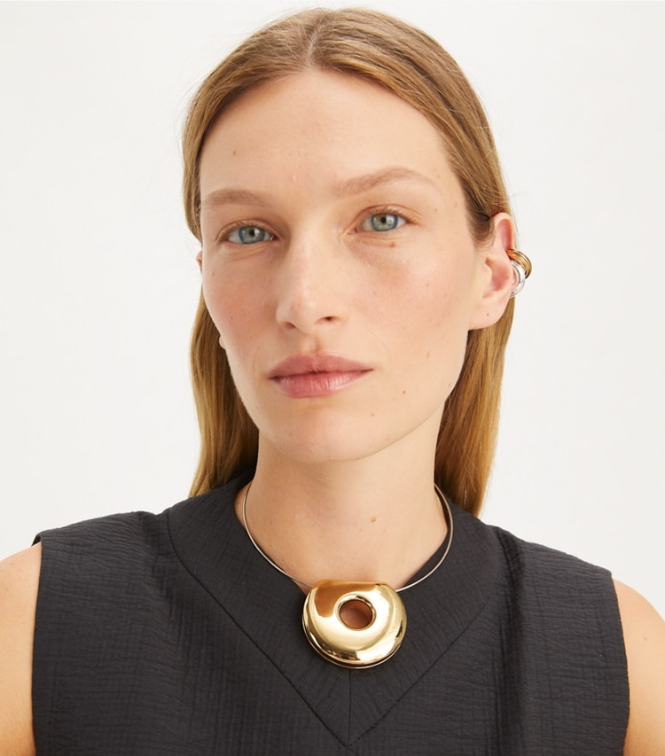 Tory Burch designer necklaces Pierced Collar Necklace in Light Brass / Light Silver accessory on model