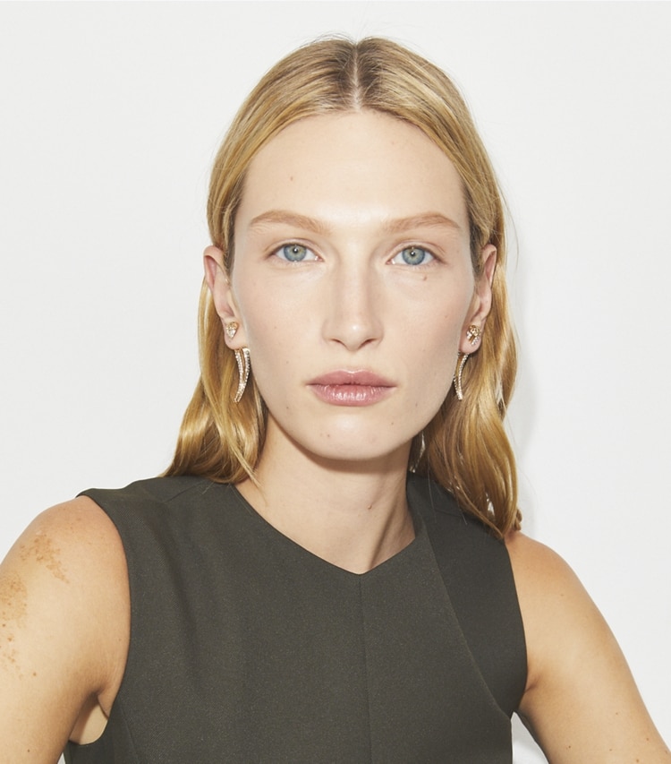 Tory Burch designer earrings Pierced Front-Back Earrings in Light Brass / Crystal accessory on model