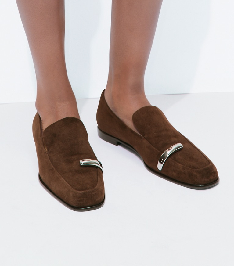 Tory Burch designer flats Pierced Loafer in DARK COCOA / SILVER accessory on model